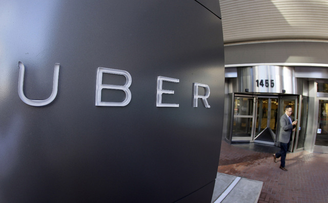 Uber said Thursday, Aug. 18, 2016, that an unspecified number of autonomous Ford Fusions with human backup drivers will pick up passengers in Pittsburgh. (Eric Risberg/AP)