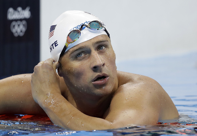 In this Tuesday, Aug. 9, 2016, file photo, United States' Ryan Lochte checks his time in a men's 4x200-meter freestyle heat during the swimming competitions at the 2016 Summer Olympics, in Rio de  ...