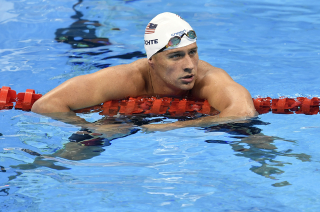 In this Aug. 9, 2016, file photo, United States' Ryan Lochte checks his time after a men' 4x200-meter freestyle relay heat during the swimming competitions at the 2016 Summer Olympics in Rio de Ja ...