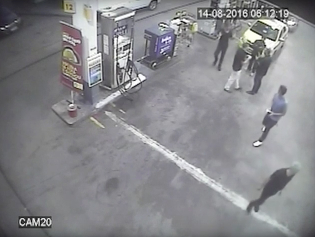 In this Sunday, Aug. 14, 2016 frame from surveillance video released by Brazil police, swimmers from the United States Olympic team appear with Ryan Lochte, right, at a gas station during the 2 ...