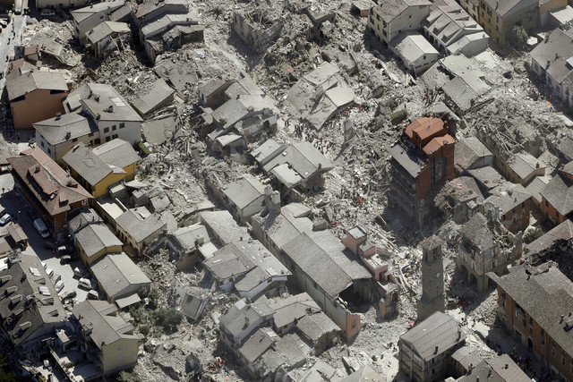 Aerial view of Amatrice in central Italy, Wednesday, Aug. 24, 2016, as it appears after a magnitude 6 quake struck at 3:36 a.m. local time and was felt across a broad swath of central Italy, inclu ...