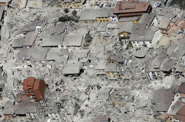 This aerial photo shows the damaged buildings in the town of Amatrice, central Italy, after an earthquake, Wednesday, Aug. 24, 2016. The magnitude 6 quake struck at 3:36 a.m. local time and was fe ...