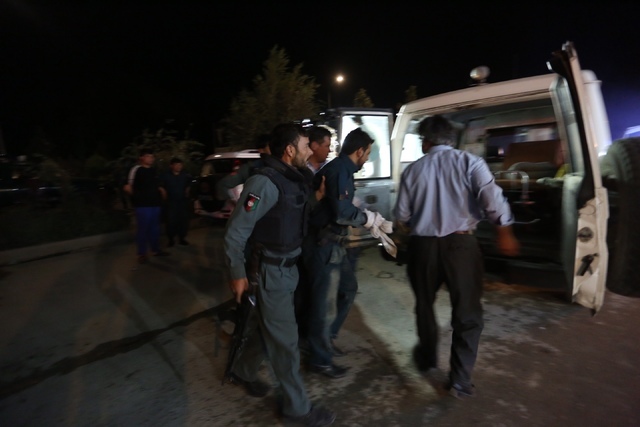 Afghan policemen wounded in a complex Taliban attack on the campus of the American University in the Afghan capital Kabul on Wednesday, Aug. 24, 2016. University President Mark English told The As ...