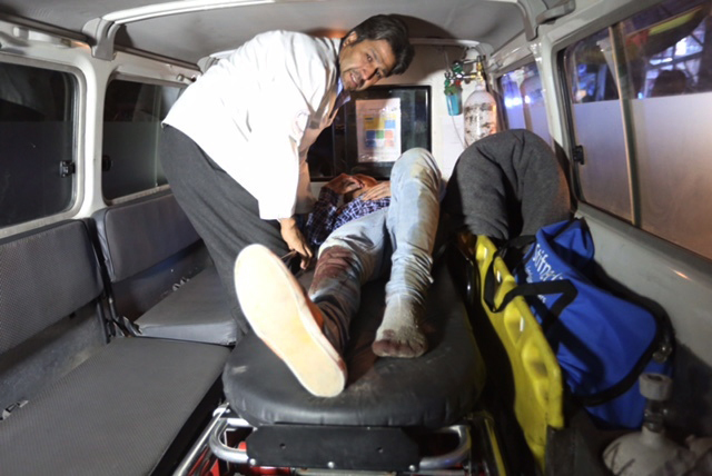 A wounded person is treated in an ambulance after a complex Taliban attack on the campus of the American University in the Afghan capital Kabul on Wednesday, Aug. 24, 2016.  (Rahmat Gul/AP)