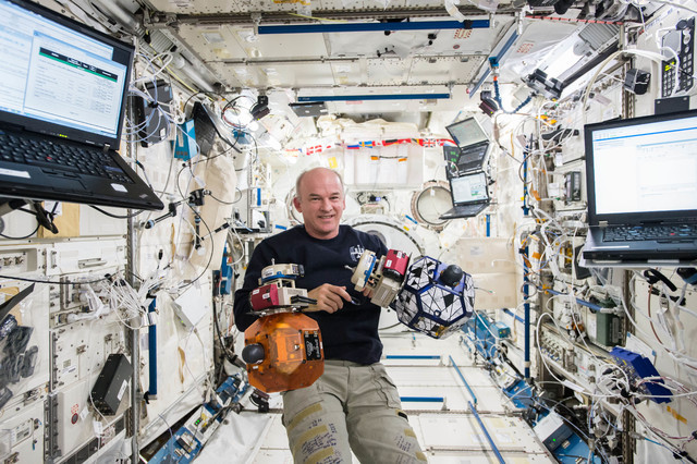 Astronaut Jeff Williams monitors bowling ball-sized internal satellites known as SPHERES (Synchronized Position Hold, Engage, Reorient, Experimental Satellites) during a maintenance run in the Int ...