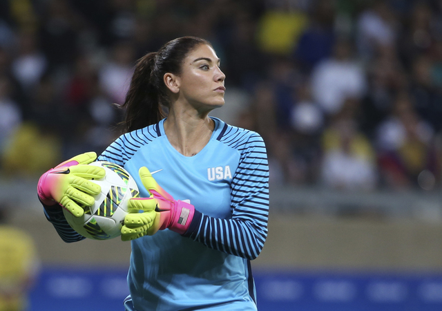 In this Aug. 3, 2016, file photo, U.S. goalkeeper Hope Solo takes the ball during a women's Olympic football tournament match against New Zealand in Belo Horizonte, Brazil. Solo has been suspended ...