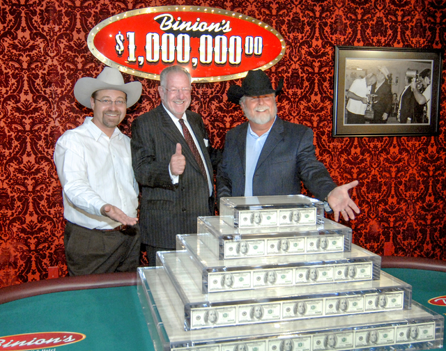 Mayor Oscar Goodman, center, poses with Binion's General Manager Tim Lager, left, and Binion's Owner Terry Caudill at the celebration of the return on Binion's million-dollar display in Las Vegas  ...