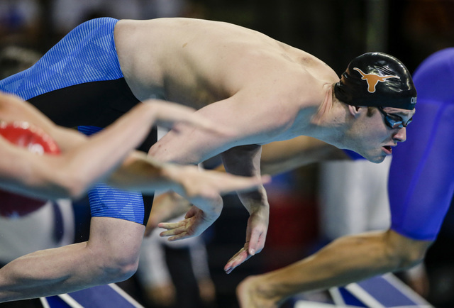 FILE - In this July 1, 2016 file photo, Jack Conger dives at the start of his heat in the men's 100-meter butterfly semifinals at the U.S. Olympic swimming trials in Omaha, Neb. The U.S. Olympic C ...