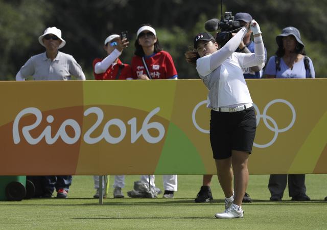 Inbee Park of South Korea watches her tee shot on the third hole during the third round at the 2016 Summer Olympics in Rio de Janeiro, Friday, Aug. 19, 2016. (Alastair Grant/AP)