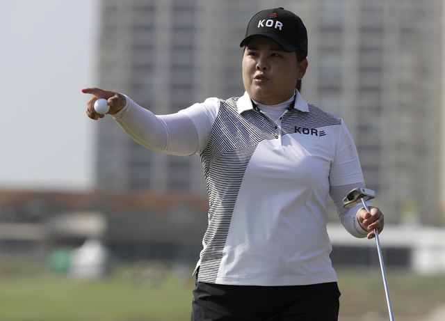 Inbee Park of South Korea gestures after putting the 10th hole during the third round of the women's golf event at the 2016 Summer Olympics in Rio de Janeiro, Friday, Aug. 19, 2016. (Alastair Gran ...