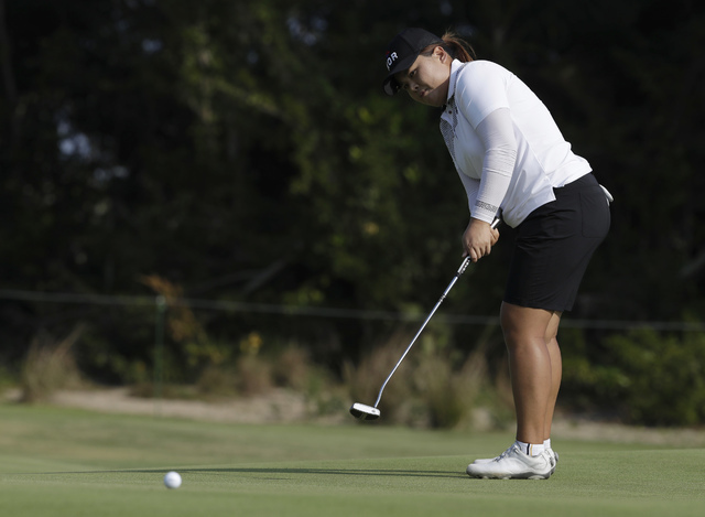Inbee Park of South Korea putts on the 13th hole during the third round of the women's golf event at the 2016 Summer Olympics in Rio de Janeiro, Friday, Aug. 19, 2016. (Alastair Grant/AP)