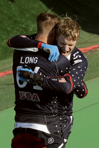 First placed Connor Fields, right, celebrates with third placed Nicholas Long, both of the United States, left, after the men's BMX cycling final during the 2016 Summer Olympics in Rio de Janeiro, ...