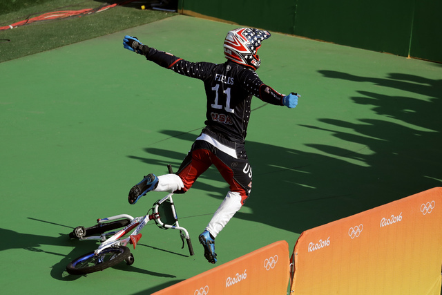 Connor Fields of the United States celebrates after winning gold in the men's BMX cycling final during the 2016 Summer Olympics in Rio de Janeiro, Brazil, Friday, Aug. 19, 2016. (Victor R. Caivano/AP)