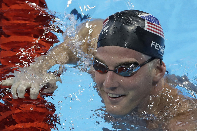 In this Aug. 2, 2016, file photo, U.S. swimmer James Feigen smiles during a swimming training session prior to the 2016 Summer Olympics in Rio de Janeiro, Brazil. Feigen apologized for the "seriou ...