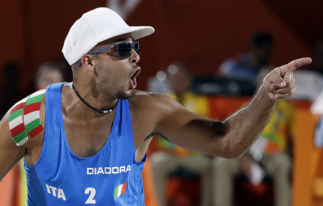 Italy's Adrian Carambula Raurich celebrates a point over Canada during a men's beach volleyball match at the 2016 Summer Olympics in Rio de Janeiro, Brazil, Monday, Aug. 8, 2016. (AP Photo/Marcio  ...