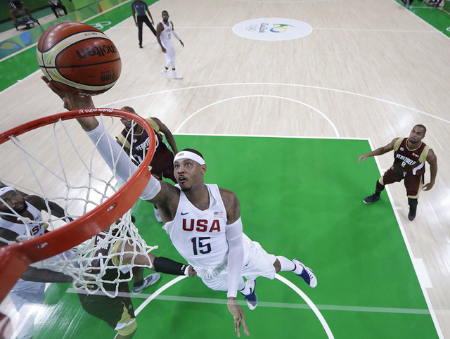 United States' Carmelo Anthony (15) scores against Venezuela during a men's basketball game at the 2016 Summer Olympics in Rio de Janeiro, Brazil, Monday, Aug. 8, 2016. (AP Photo/Eric Gay)