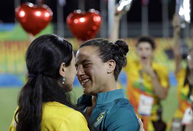 Brazil's Isadora Cerullo, right, shares a moment with her partner Marjorie Enya, after she was asked her to marry her, after the medal ceremony for the women's rugby sevens match at the Summer Oly ...