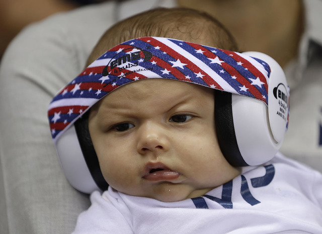 United States' Michael Phelps' son Boomer wears ear protection during the swimming competitions at the 2016 Summer Olympics, Monday, Aug. 8, 2016, in Rio de Janeiro, Brazil. (AP Photo/Michael Sohn)