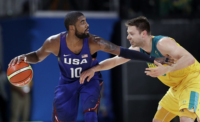 United States Kyrie Irving 10 drives around Australia s Matthew