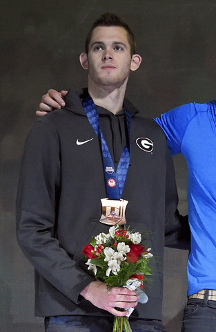 In this July 3, 2016 file photo, Gunnar Bentz stands with teammates during the men's 400-meter relay team medal ceremony at the U.S. Olympic swimming trials in Omaha, Neb. (AP Photo/Mark J. Terril ...