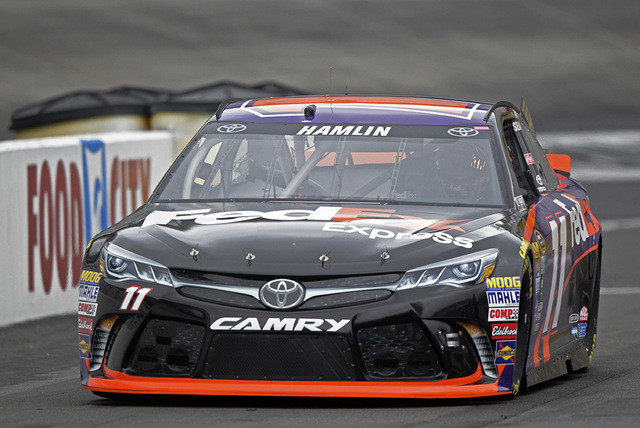 Denny Hamlin makes his way down pit road during practice for a NASCAR Sprint Series auto race on Friday, Aug. 19, 2016 in Bristol, Tenn. (AP Photo/Wade Payne)