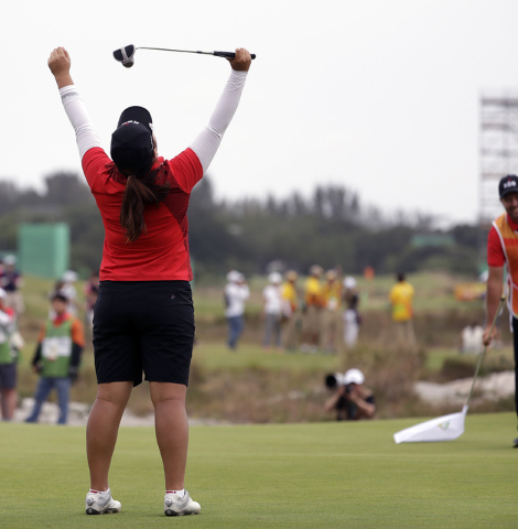 Inbee Park of South Korea, reacts after winning the gold medal on the 18th hole during the final round of the women's golf event at the 2016 Summer Olympics in Rio de Janeiro, Brazil, Saturday, Au ...