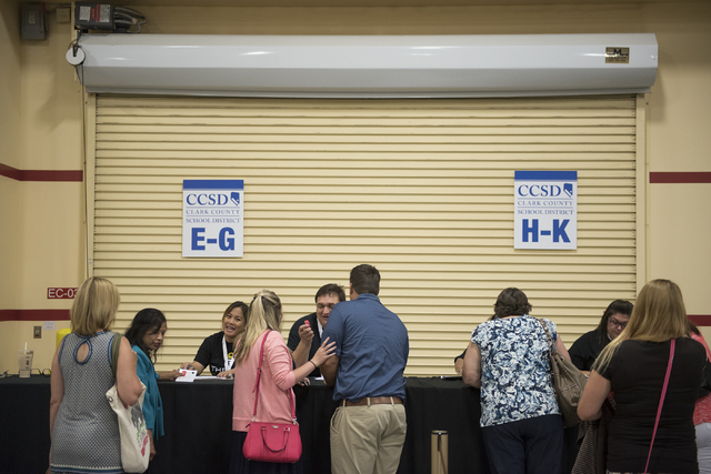 CCSD incoming teachers register for badges during a Clark County School District event to launch the 2016-17 academic year at the South Point hotel-casino in Las Vegas on Wednesday, Aug. 17. 2016. ...