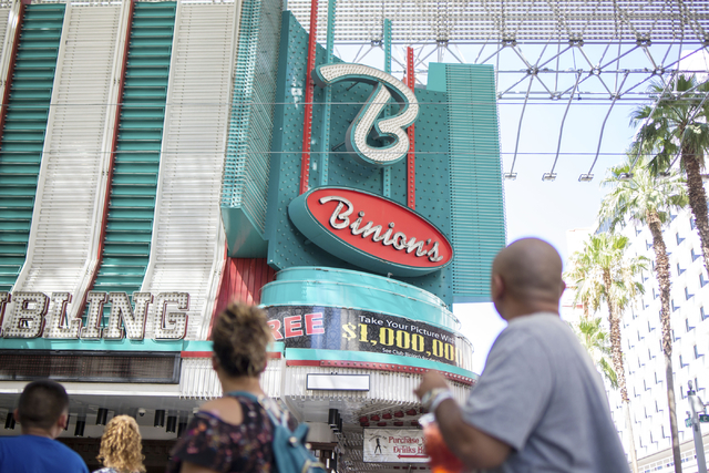Pedestrians walk by the historical Binion's Gambling Hall & Hotel on Thursday, Aug. 11, 2016, in Las Vegas. Elizabeth Page Brumley/Las Vegas Review-Journal Follow @ELIPAGEPHOTO