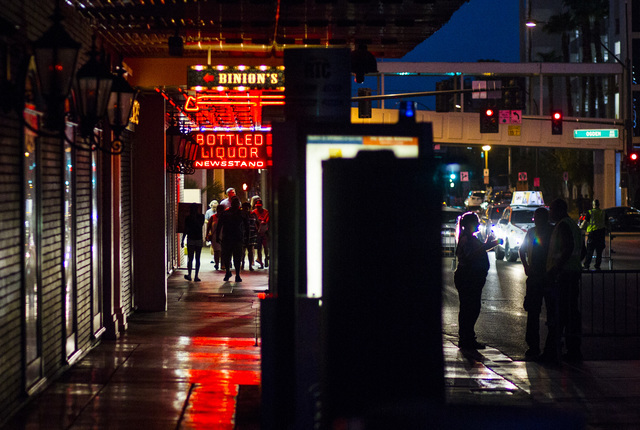 People walk along Casino Center Avenue outside of Binion's hotel-casino in downtown Las Vegas on Wednesday, Aug. 10, 2016. Chase Stevens/Las Vegas Review-Journal Follow @csstevensphoto
