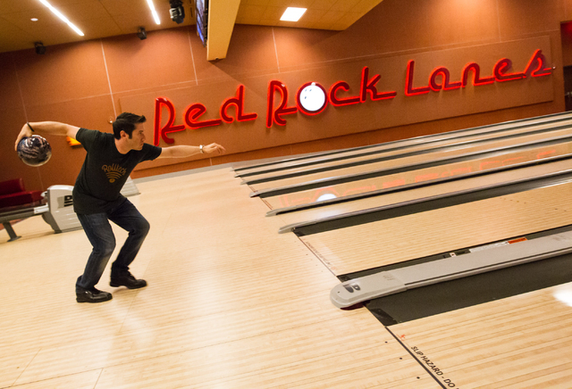 Rolltech founder and CEO Rich Belsky  prepares to roll a bowling ball down a lane as the company runs tests for their bowling app and website at Red Rock Lanes in Red Rock Resort in Las Vegas on M ...