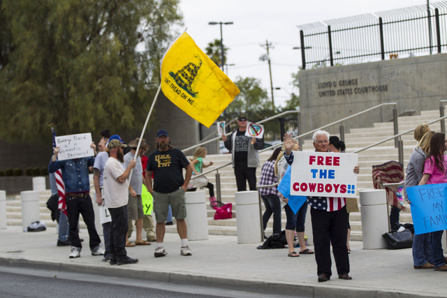 People protest outside the Lloyd George U.S. Courthouse ahead of an arraignment for Ammon and Ryan Bundy, among others, in Las Vegas on Friday, April 15, 2016. The arraignment was for charges stem ...