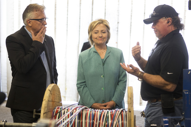 Democratic presidential nominee Hillary Clinton tours Mojave Electric with Donald Campbell, left, executive director for the Southern Nevada Chapter of the National Electrical Contractors Associat ...