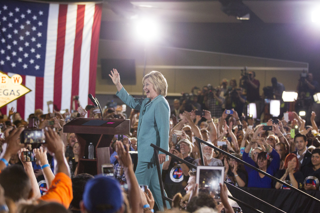 Democratic presidential nominee Hillary Clinton takes the stage at a campaign rally at the International Brotherhood of Electrical Workers headquarters on Thursday, Aug. 4, 2016, in Las Vegas. Eri ...