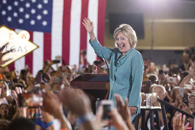 Democratic presidential nominee Hillary Clinton takes the stage at a campaign rally at the International Brotherhood of Electrical Workers headquarters on Thursday, Aug. 4, 2016, in Las Vegas. Eri ...