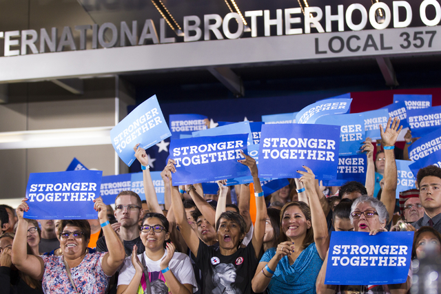 Supporters cheer for Democratic presidential candidate Hillary Clinton speaks during a campaign rally at the International Brotherhood of Electrical Workers headquarters on Thursday, Aug. 4, 2016, ...