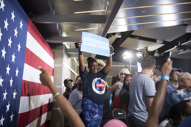 Supporters get ready to see Democratic presidential candidate Hillary Clinton during a campaign rally at the International Brotherhood of Electrical Workers headquarters on Thursday, Aug. 4, 2016, ...