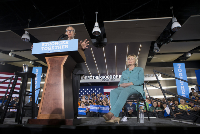 U.S. Sen. Harry Reid introduces Democratic presidential candidate Hillary Clinton during a campaign rally at the International Brotherhood of Electrical Workers headquarters on Thursday, Aug. 4, 2 ...
