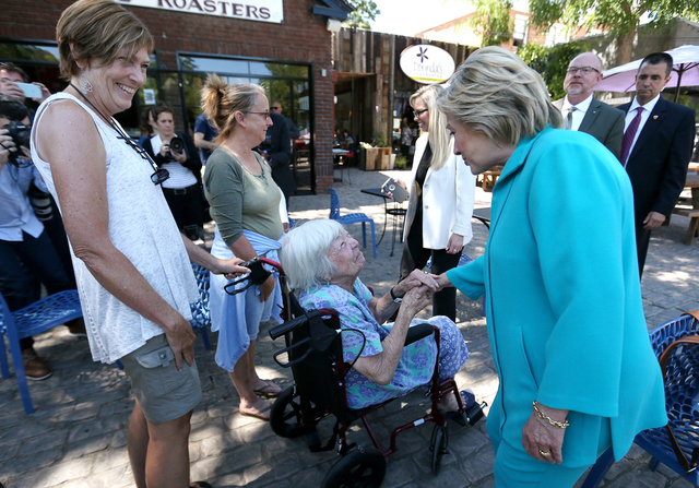 Democratic presidential nominee Hillary Clinton talks with Jennifer Snyder, 85, and her daughter Lisa during a campaign stop in Reno, Nev., on Thursday, Aug. 25, 2016. Cathleen Allison/Las Vegas R ...