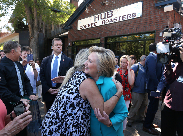 Democratic presidential nominee Hillary Clinton gets a hug from a supporter during a campaign stop in Reno, Nev., on Thursday, Aug. 25, 2016. Cathleen Allison/Las Vegas Review-Journal