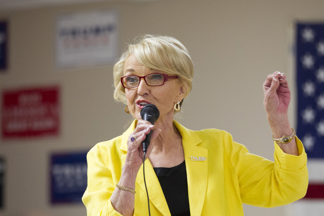 Former Arizona Gov. Jan Brewer speaks during the grand opening for the new campaign office for Republican presidential candidate Donald Trump in Las Vegas on Saturday, Aug. 27, 2016, in Las Vegas. ...