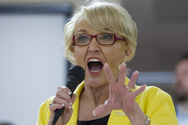 Former Arizona Gov. Jan Brewer speaks during the grand opening for the new campaign office for Republican presidential candidate Donald Trump in Las Vegas on Saturday, Aug. 27, 2016, in Las Vegas. ...