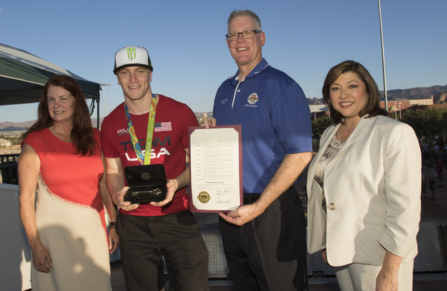 BMX Olympic gold medalist Connor Fields, second left, poses for a photo with Henderson Mayor Andy Haffen, Councilwoman Debra March, left, and Councilwoman Gerri Schroder at the Whitney Mesa BMX Tr ...