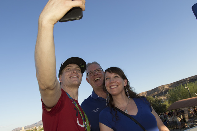 BMX Olympic gold medalist Connor Fields, left, takes a selfie with Henderson Mayor Andy Haffen, center, and his daughter Amy Haffen after a celebration at the Whitney Mesa BMX Track on Tuesday, Au ...