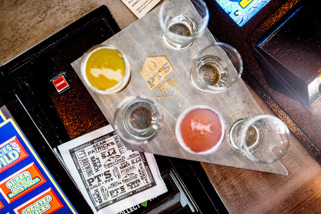 A selecton of in house craft beers are displayed on a Nevada shaped platter made in house at PT’s Brewing Company off of Tenaya Way and Cheyenne Avenue in Las Vegas on Thursday, Aug. 4, 2016. El ...