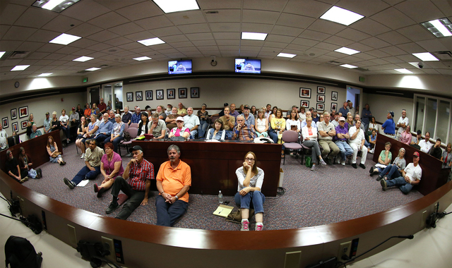 Four overflow rooms were needed as more than 700 people attend a subcommittee hearing at the Legislative Building in Carson City, Nev., on Friday, Aug. 26, 2016. Angry domestic well owners are con ...