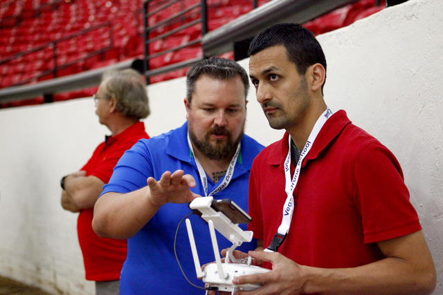 Sam Zamarron, right, of Irondale, Alabama, gets tips on drone piloting from William OՄonnell of AviSight Aerial and Drone Services during a pilot training course at the South Point Casino on Thur ...
