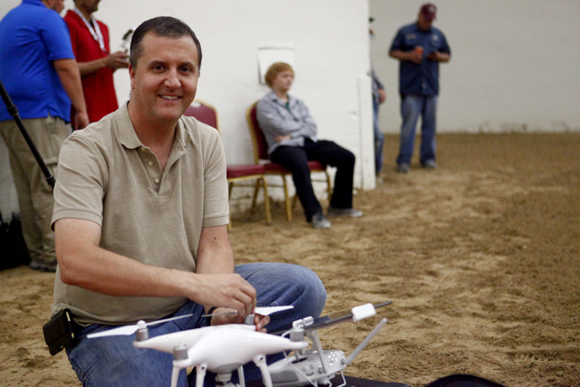 Gary Buzel, of AviSight Aerial and Drone Services, preps a DJI Phantom drone for flight during a during a drone pilot training course by AviSight at the South Point Casino on Thursday,  Aug. 25, 2 ...