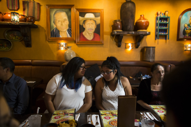 Eighteen-year-old Noemi Guigui, left, talks with sister Brenda, 22, during a lunch with U.S. Senate Democratic candidate Catherine Cortez Masto, not pictured, at Lindo Michoacan in Las Vegas on We ...