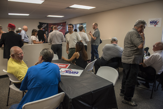 Volunteers and attendees are seen at the grand opening for a National Rifle Association campaign office at 6375 S. Pecos Road in Las Vegas, Tuesday, Aug. 9, 2016. Martin S. Fuentes/Las Vegas Revie ...