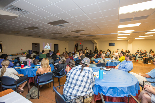 Attendees watch a live stream video by former Democratic presidential candidate and Sen. Bernie Sanders at the "Our Revolution" kickoff party held at the Veterans of Foreign Wars Center, 4337 N La ...